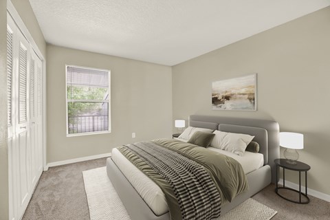 A bedroom with a large bed and a painting on the wall.