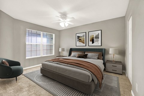 A bedroom with a large bed and a chair.