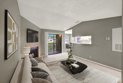 A living room with a fireplace and a couch.
