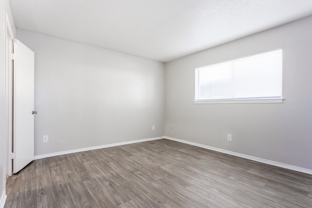Bedroom With Expansive Windows at Falls on Clearwood Apartments, Texas, 75081