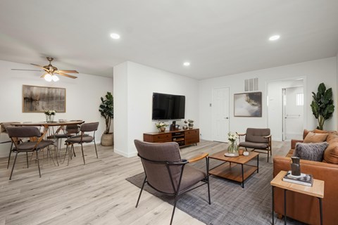 A living room with a brown chair in the center.