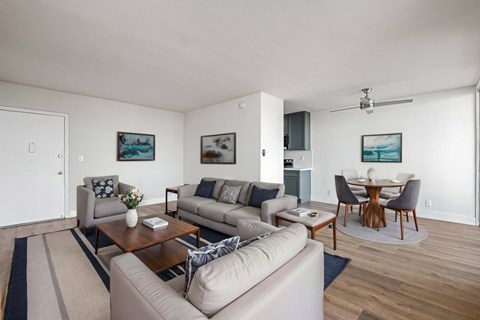 A living room with a grey couch and a coffee table.