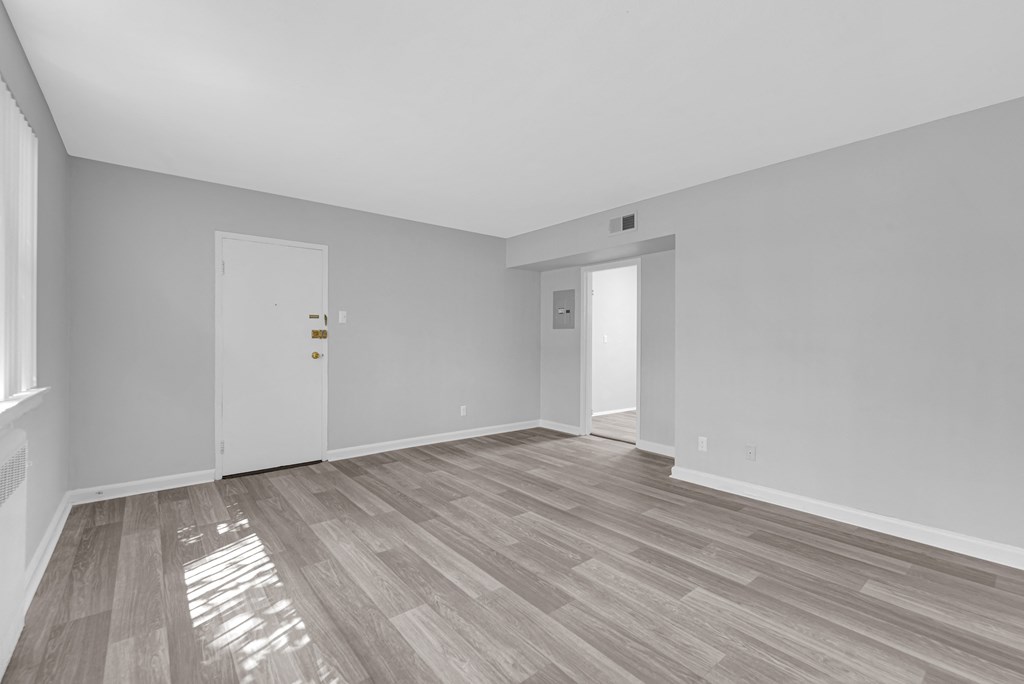 a bedroom with hardwood floors at Hampton Gardens, Saint Louis, Missouri