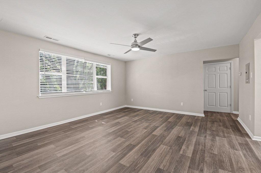 a bedroom with hardwood floors and a ceiling fan at Hampton Gardens, Saint Louis, 63139