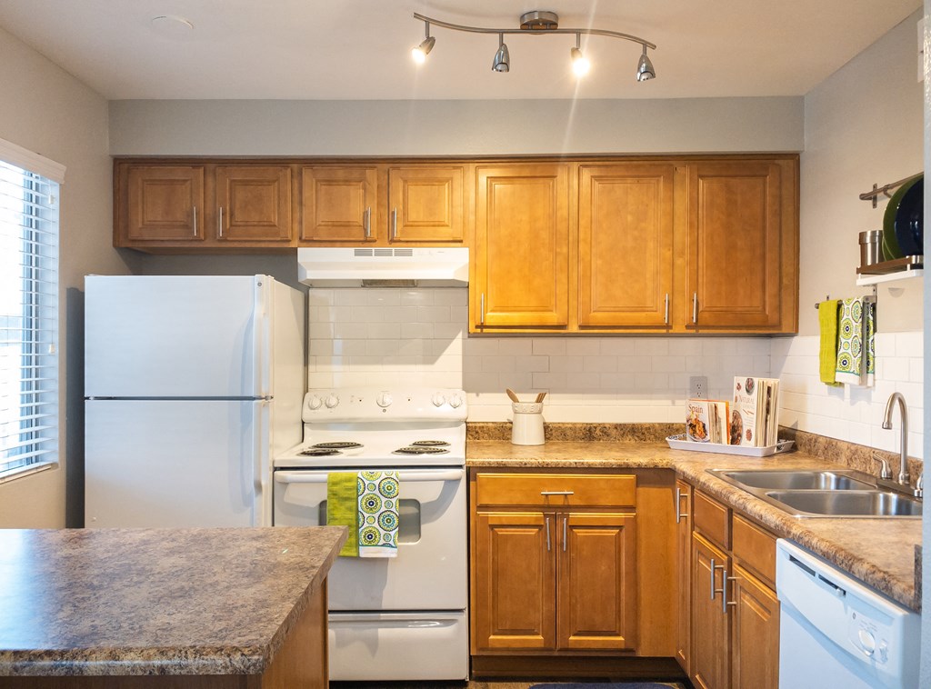 a kitchen with white appliances a kitchen with white appliances and wooden cabinets at Granite Bay, Phoenix, Arizona, 85023