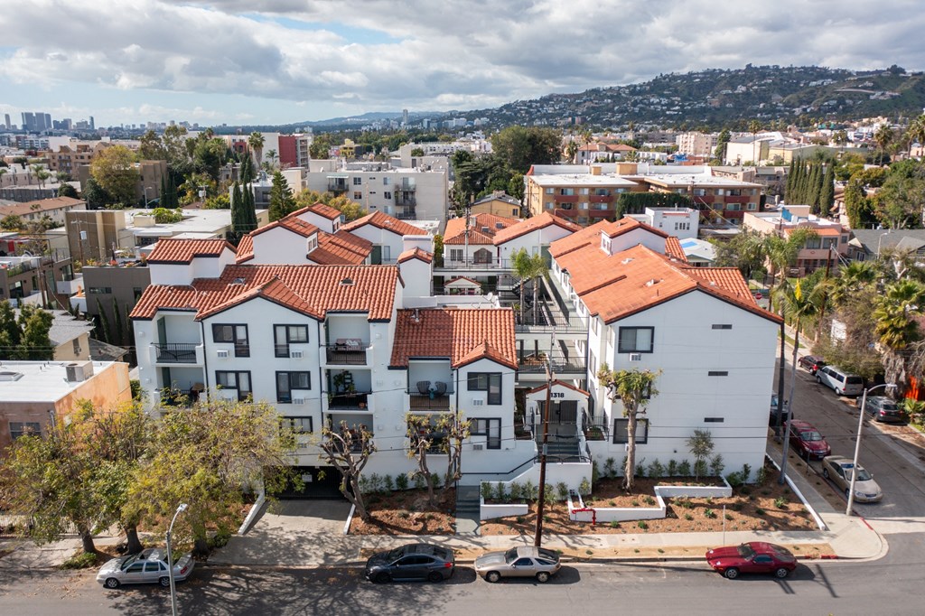 an aerial view of a row of houses in a city