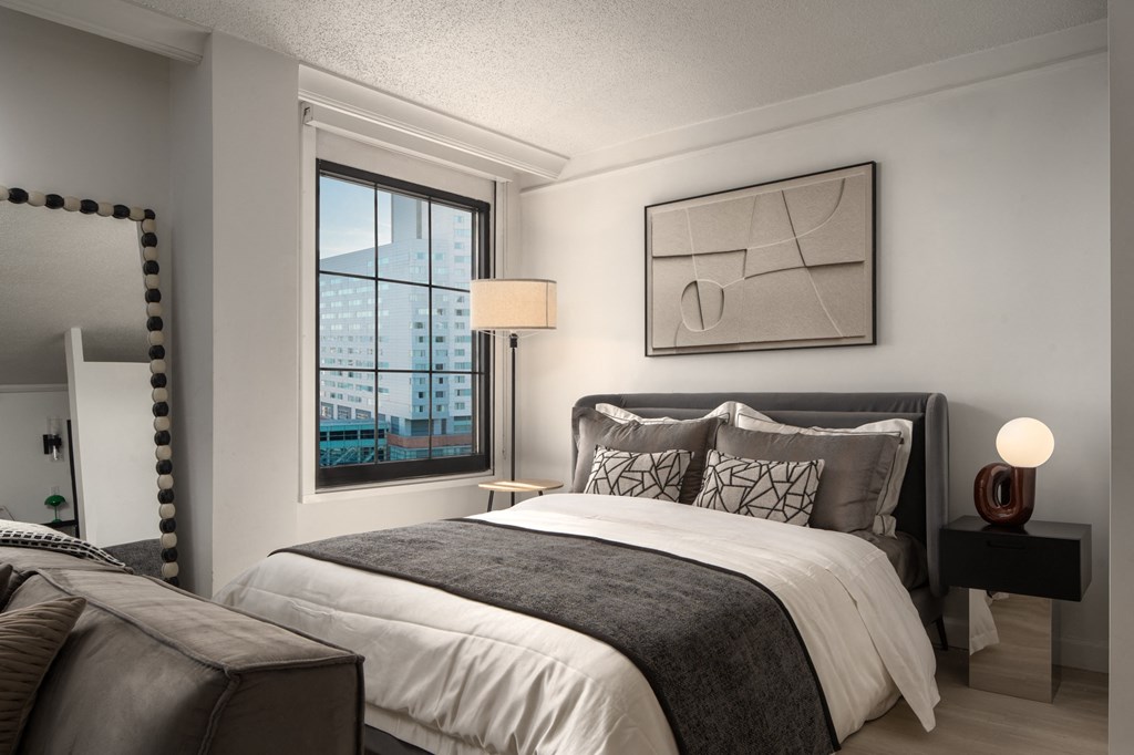 a bedroom with a bed and a window at Vision on Lombard, Baltimore Maryland