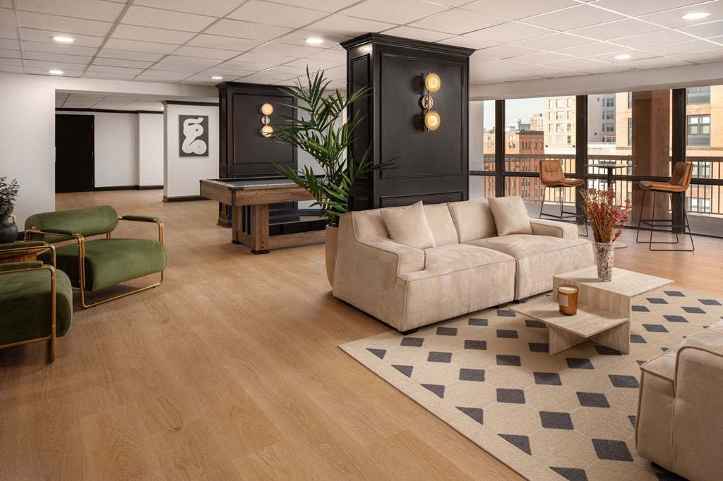 a living room with a couch and a table at Vision on Lombard, Baltimore, MD 21201