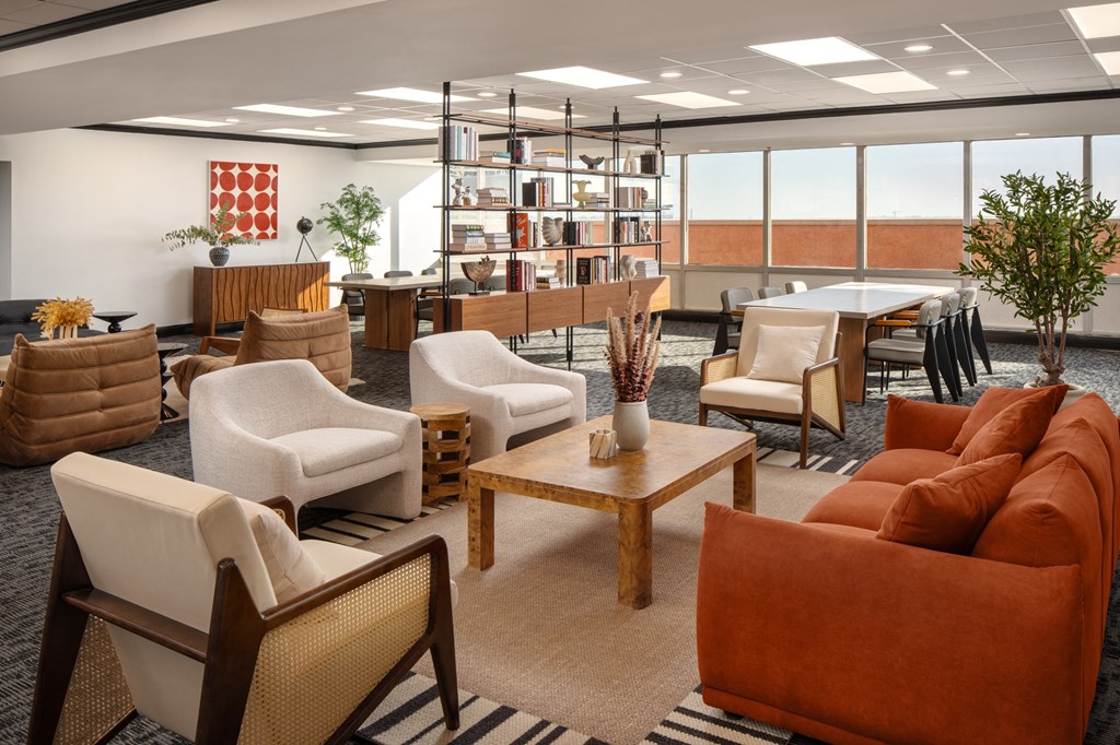a living room filled with furniture and a table with chairs at Vision on Lombard, Maryland