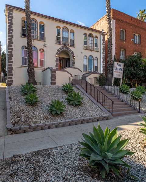 A building with a sign at Hillstone Flats Apartments, California 90004