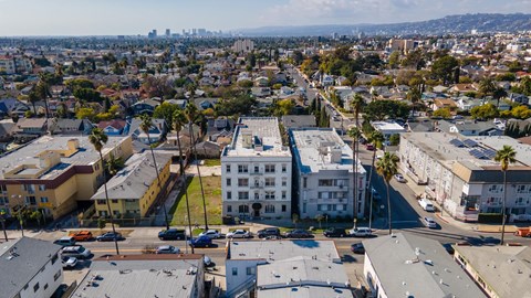 A cityscape with buildings and cars at Normandie Summit Apartments, Los Angeles, 90004