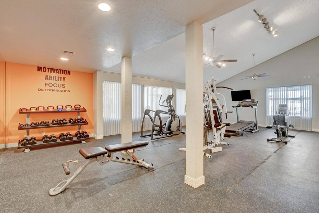 A gym with a wall that says