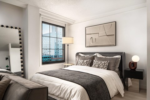 a bedroom with a bed and a window at Vision on Lombard, Baltimore, MD 21201