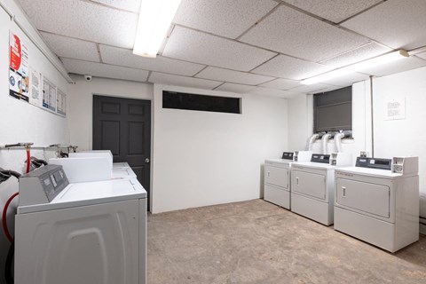 A room with a washing machine and a dryer at Westmore Manor Apartments, California, 90020