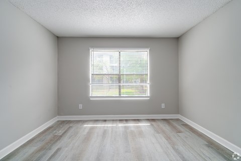an empty room with wood floors and a window at Village Lakes, Orlando, FL, 32808