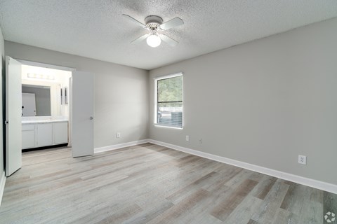 an empty living room with a ceiling fan and a window at Village Lakes, Orlando, FL, 32808