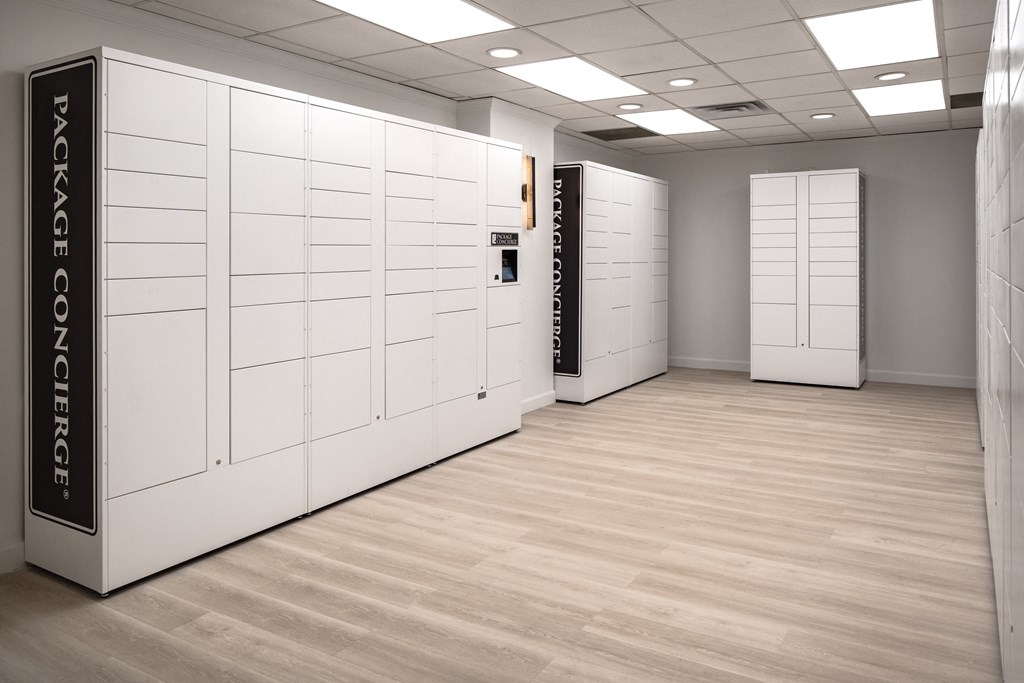 a white room with white lockers and a wood floor at Vision on Lombard, Maryland