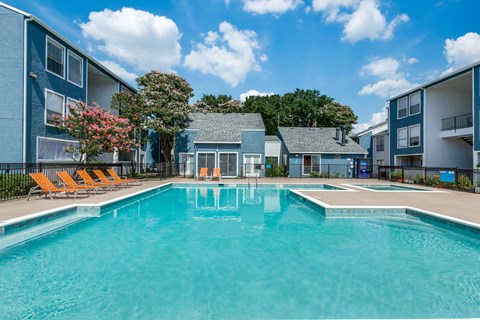 our apartments have a large pool and lounge chairs