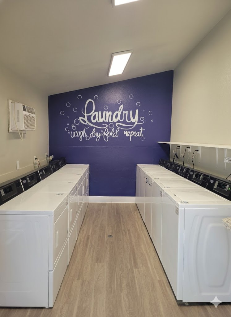 Laundry room with washers and dryers.