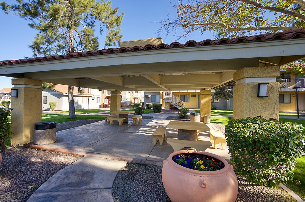 A patio area with a large planter in the center.