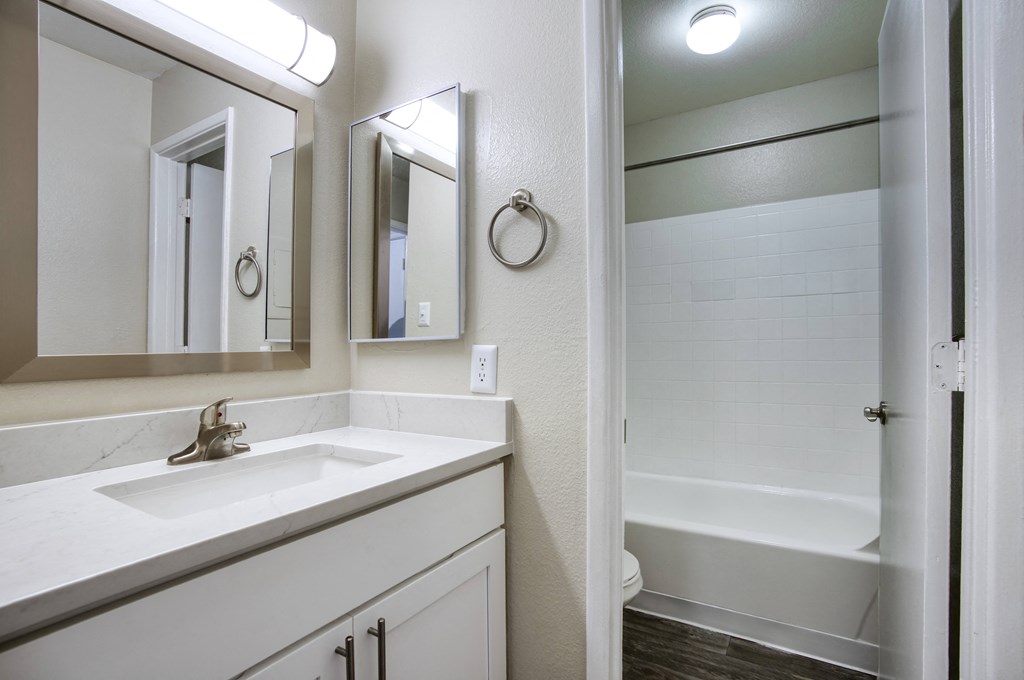 a bathroom with a sink and a bathtub at Valencia Park, Phoenix, AZ, 85008