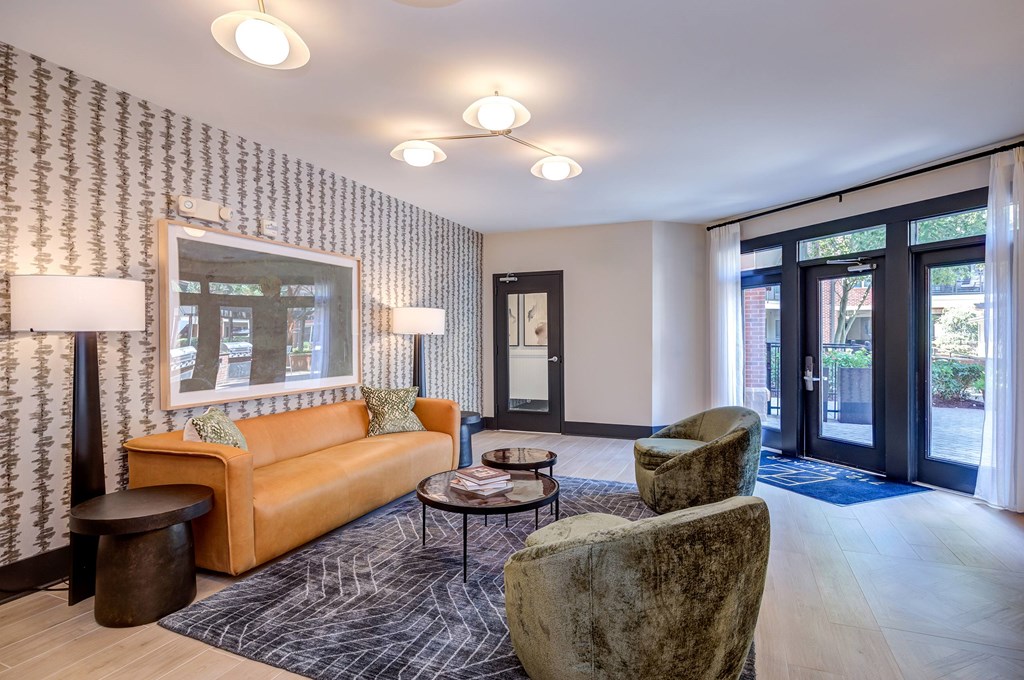 A lounge with a couch, chair, and coffee table.