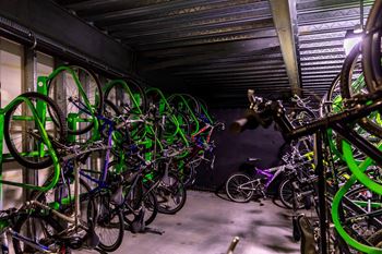 A bike rack full of bicycles.