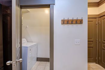A laundry room with a washer and dryer in it.