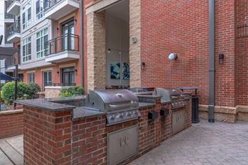 A brick wall and a grill.