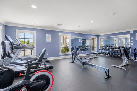 A spacious gym with a variety of exercise equipment.