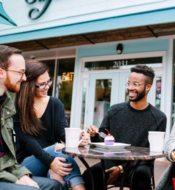 a group of people sitting at a table