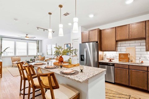 a kitchen and dining room with a counter top