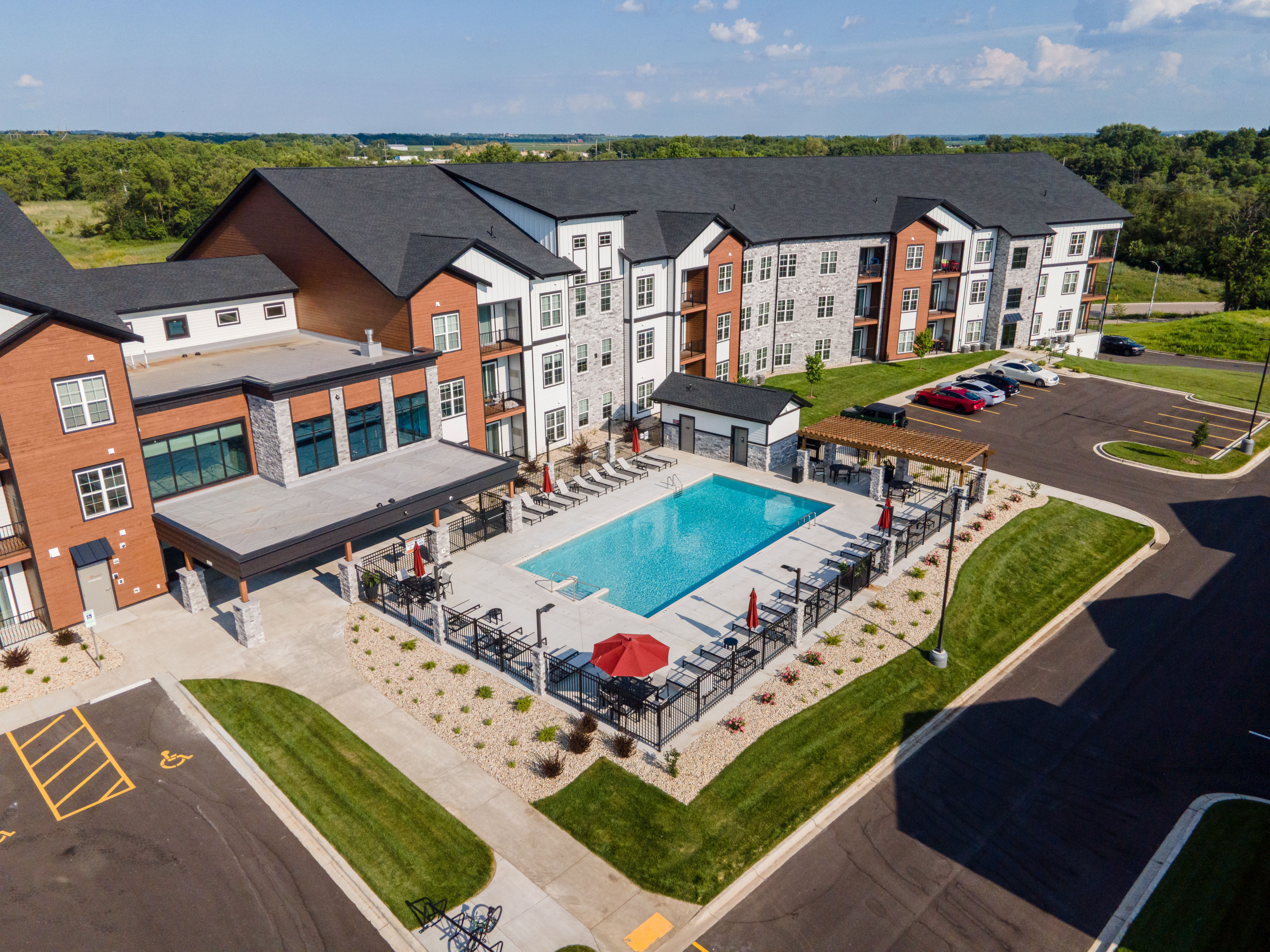 A large building with a pool in front.