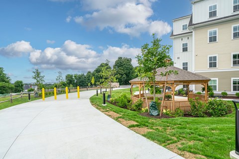 A building with a gazebo in front of it.