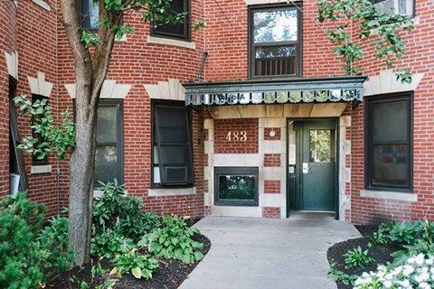 A red brick building with the number 488 on the front door.