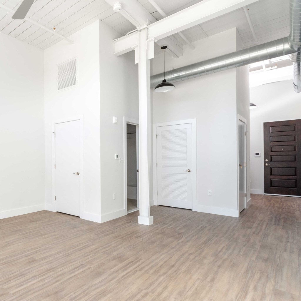 High ceilings, modern plank flooring, exposed loft elements