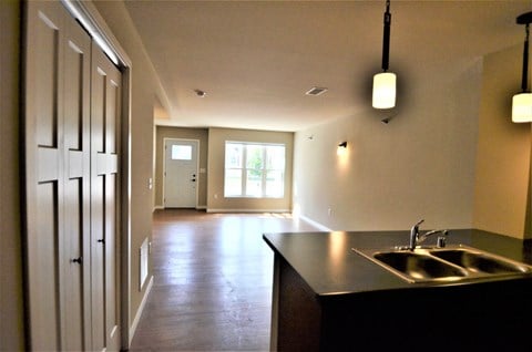 A kitchen with a sink and a window.