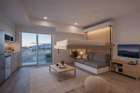 A modern living room with a large window overlooking a cityscape.