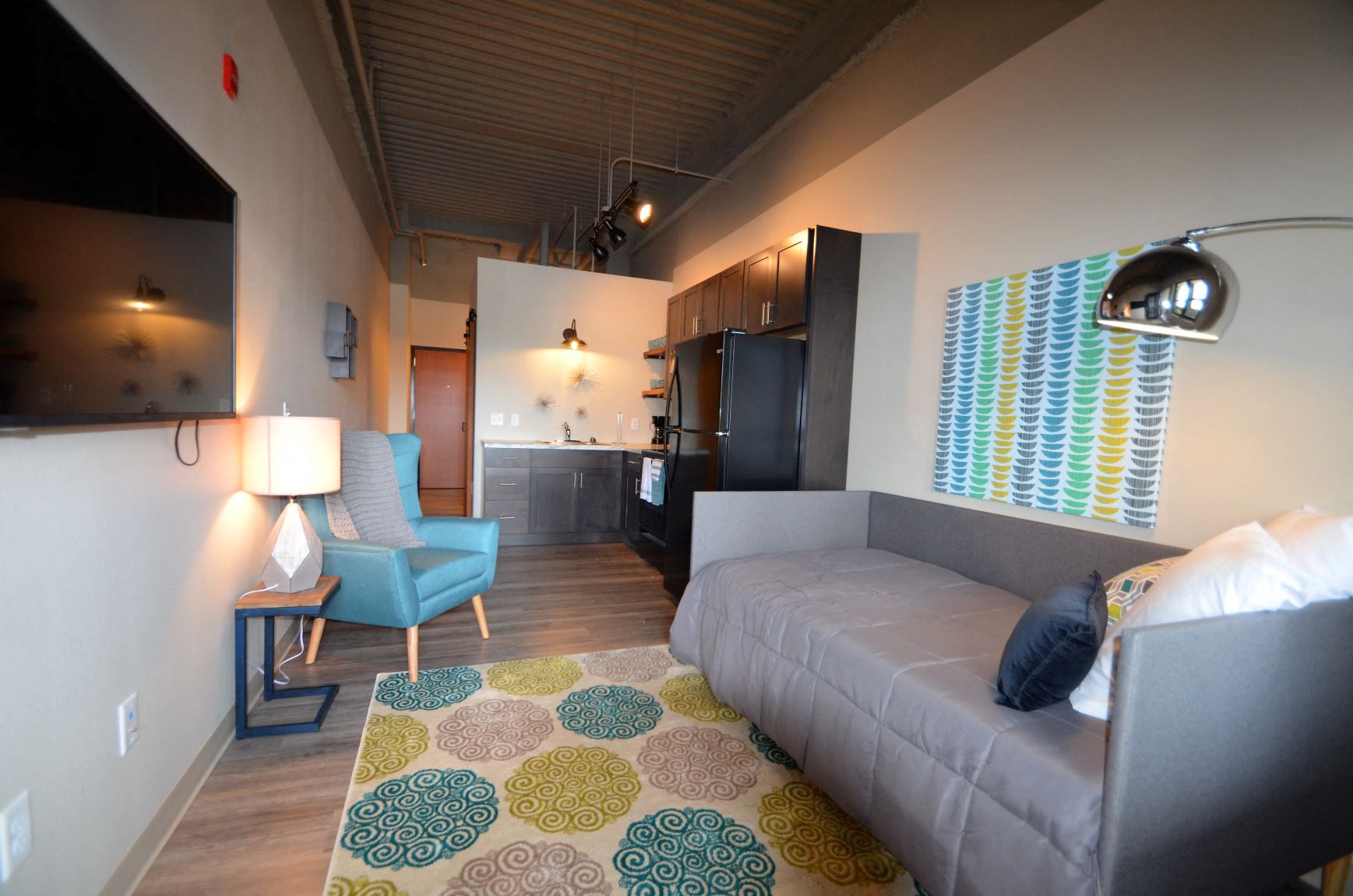 a living room with a couch and a rug