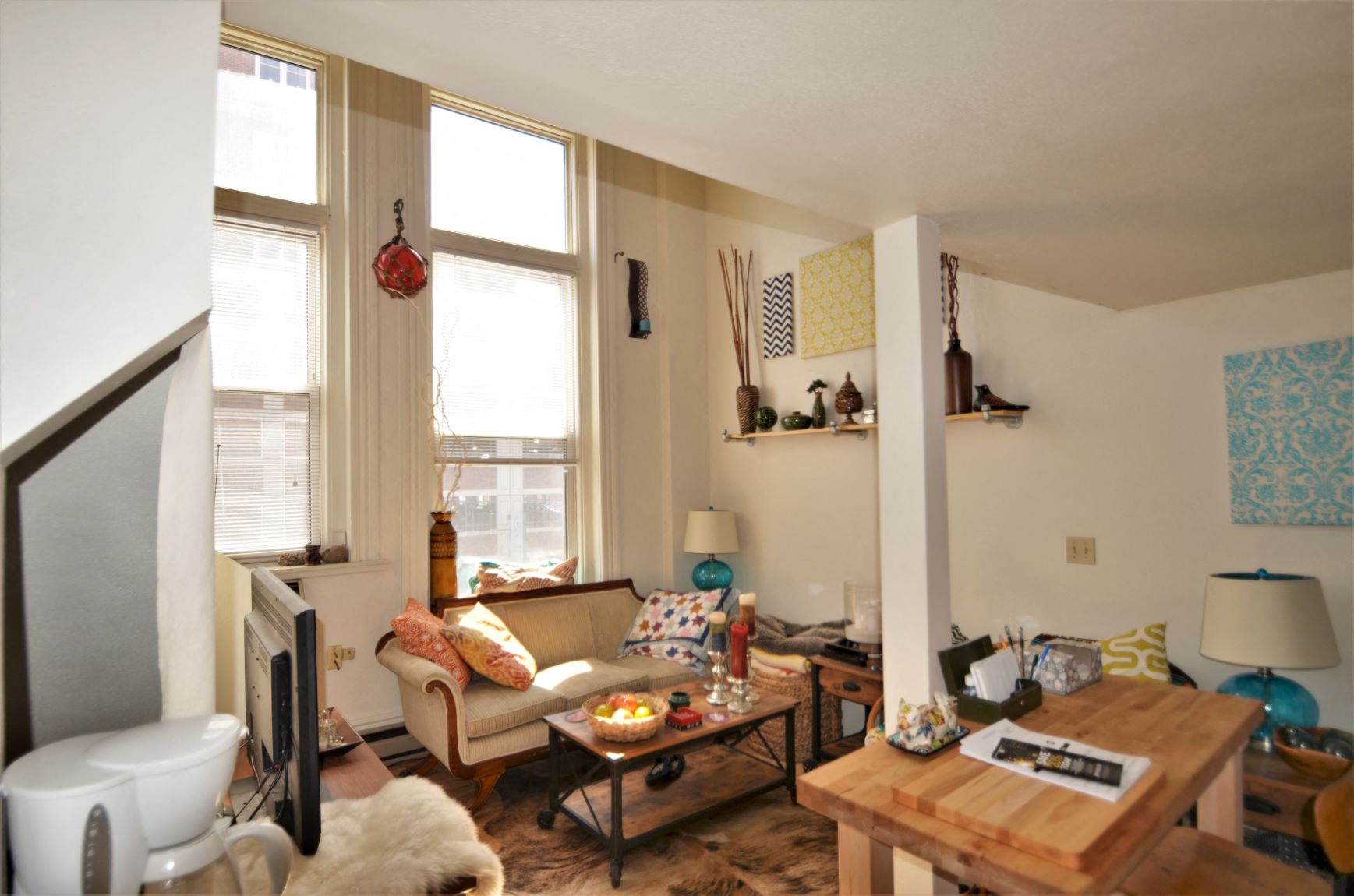 a living room with a couch and a table