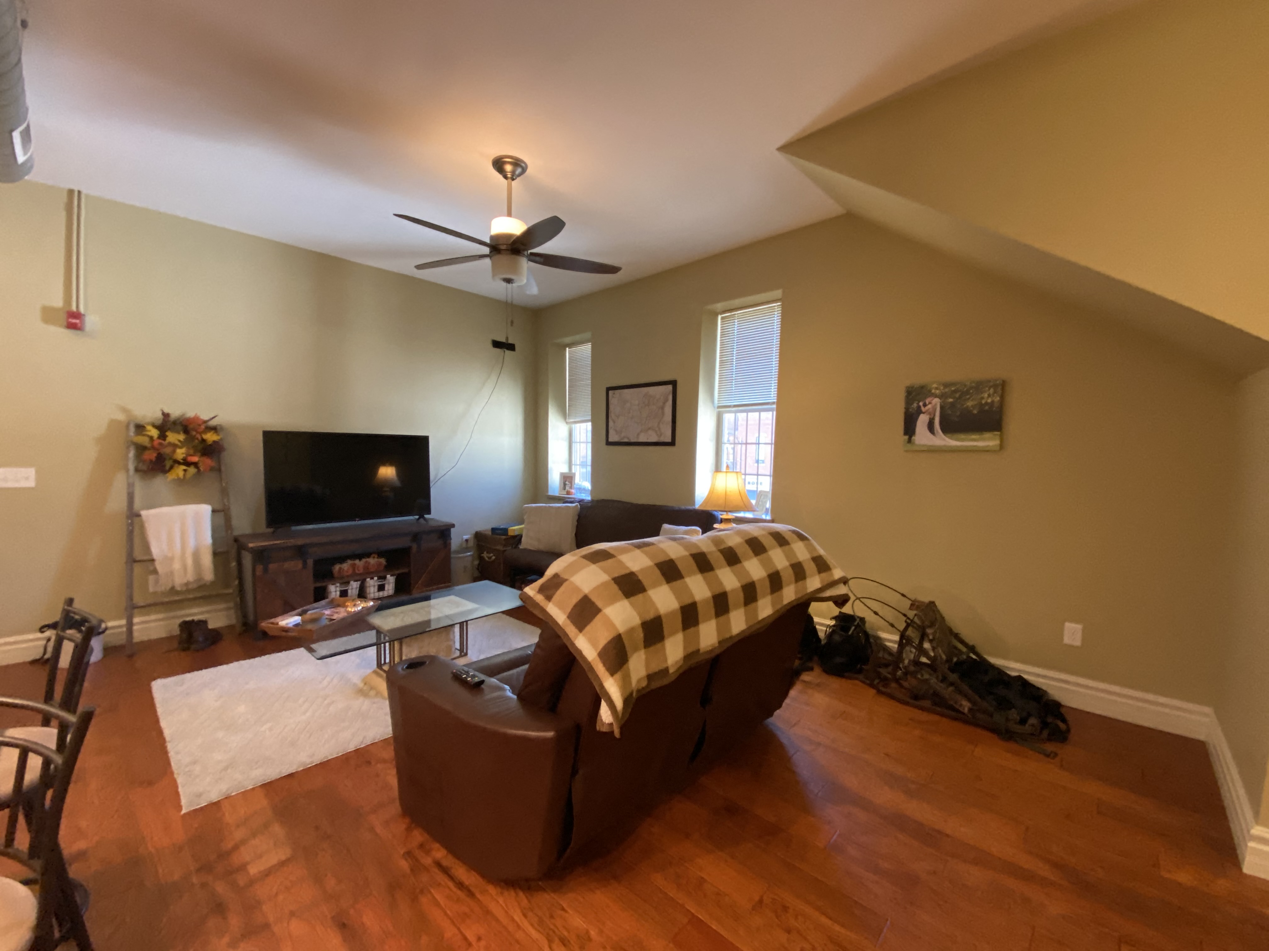 a living room with a couch and a tv