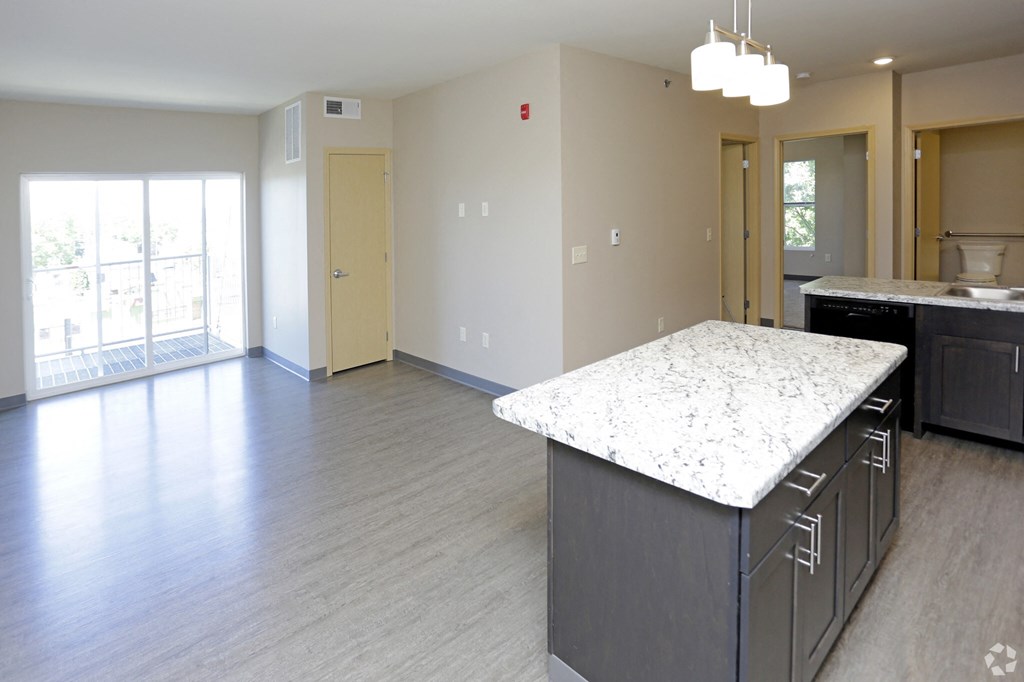 Aguilera | Large Kitchen an open concept kitchen and living room in an apartment