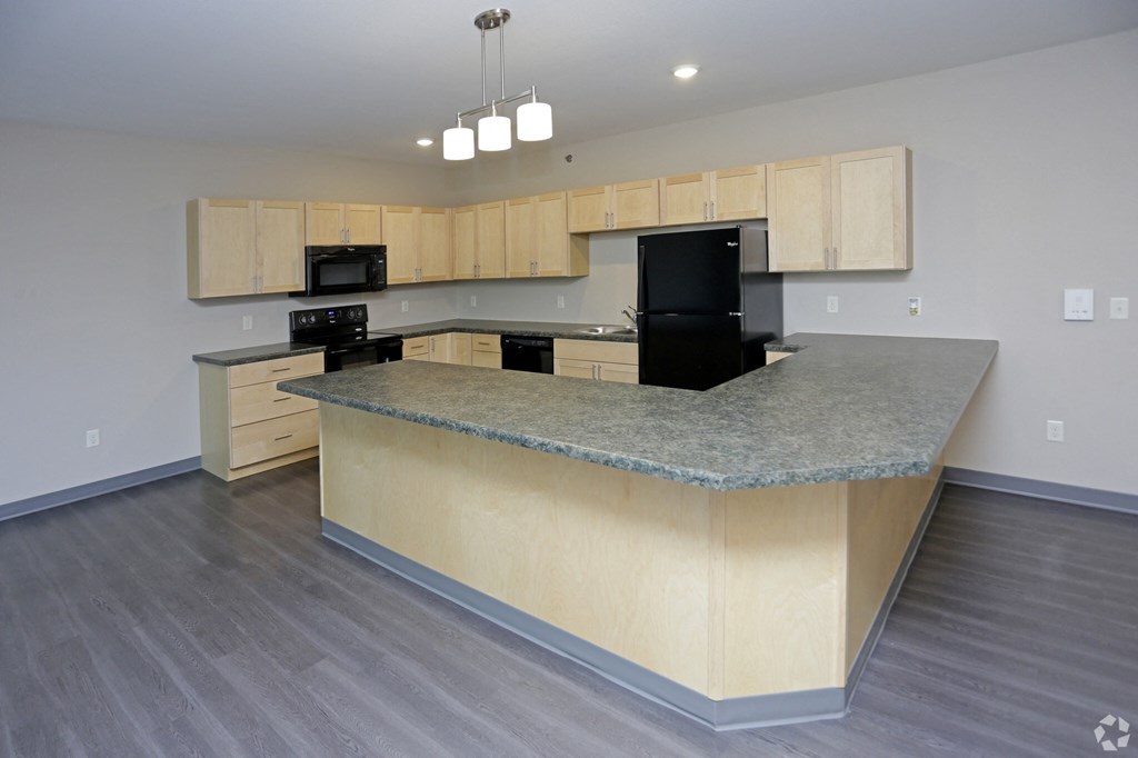 Aguilera | Large Kitchen with a large island with granite countertops