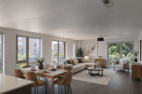 A modern living room with a dining table and chairs.
