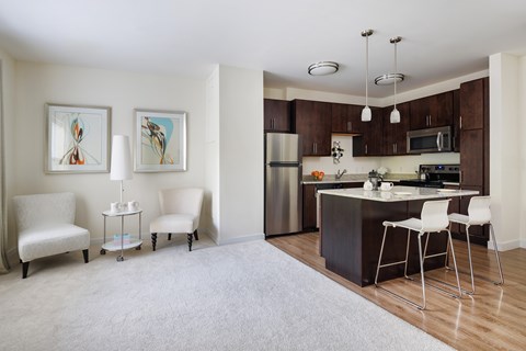 A modern kitchen with a dining table and chairs.