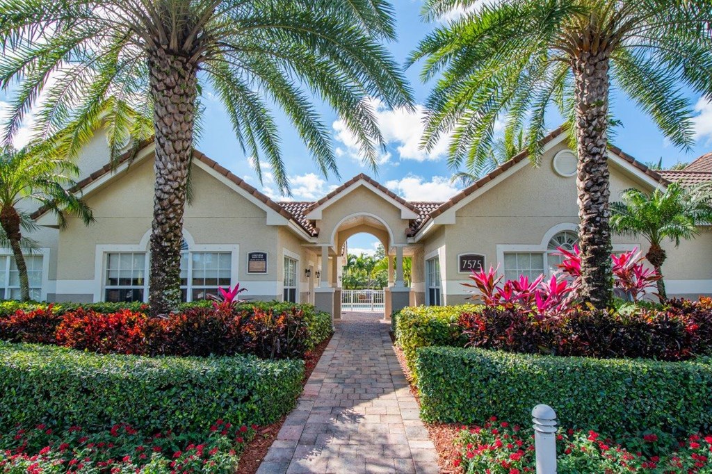 a house with palm trees in front of it