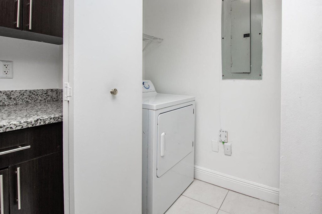 a small laundry room with a washer and dryer in it