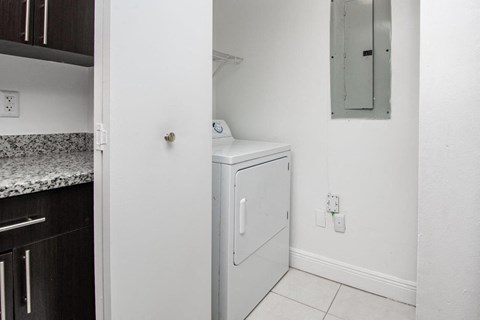 a small laundry room with a washer and dryer in it