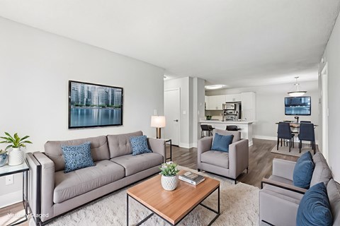 A living room with a grey couch and a coffee table.