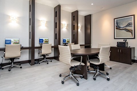 a conference room with a table and chairs